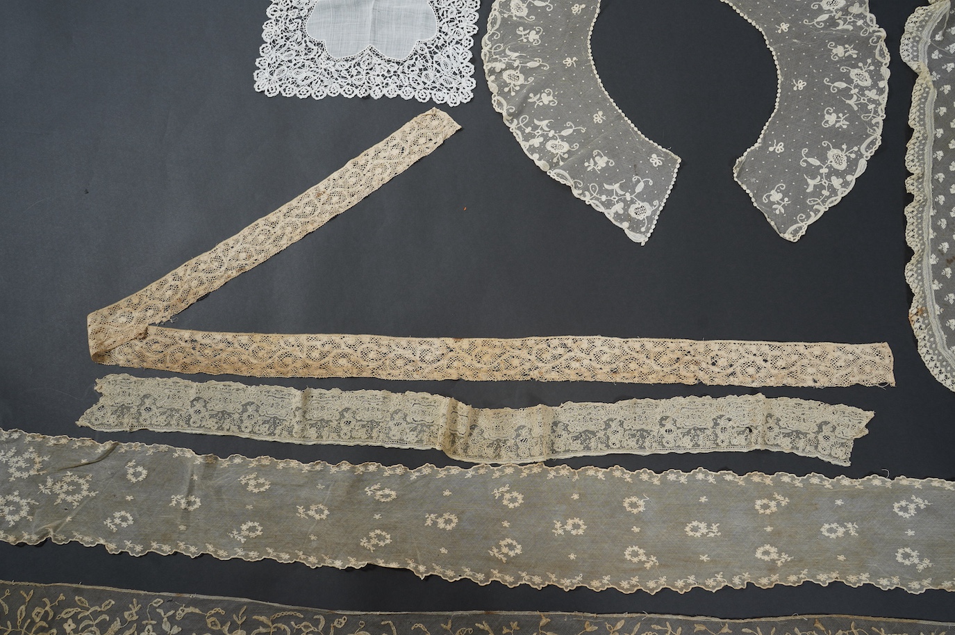 An early 19th bobbin lace length and a Brussels needle lace length, a Brussels bobbin lace wedding hankie and Brussels collar and length of trimming, a needle run collar and similar stole. (7). Brussels bobbin trim 250cm
